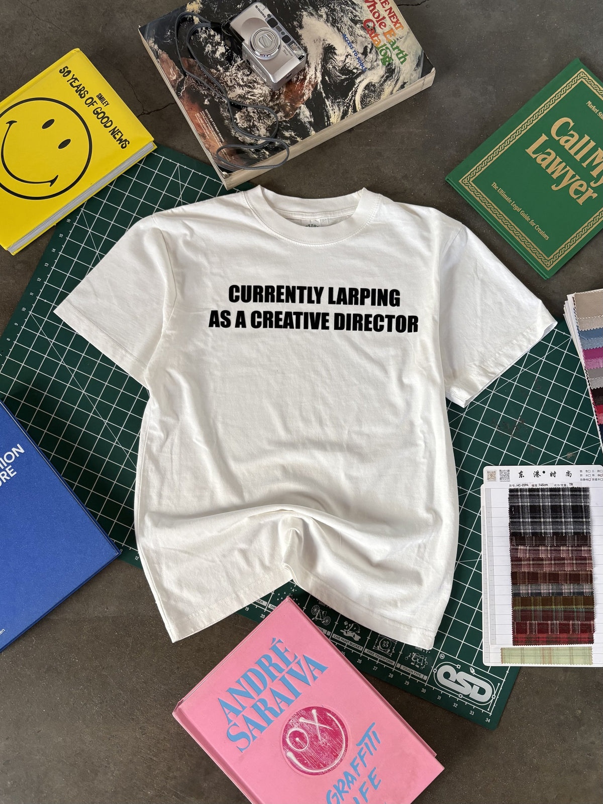 CURRENTLY LARPING CREATIVE DIRECTOR T-SHIRT - flat lay