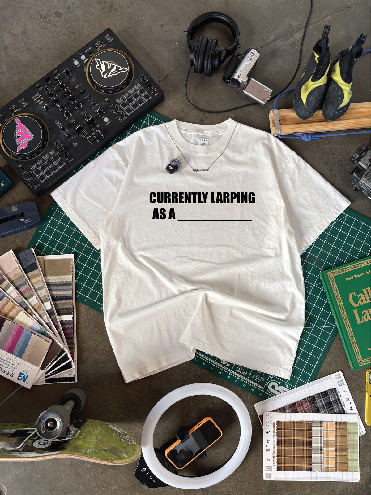CURRENTLY LARPING BLANK T-SHIRT + PEN - flat lay